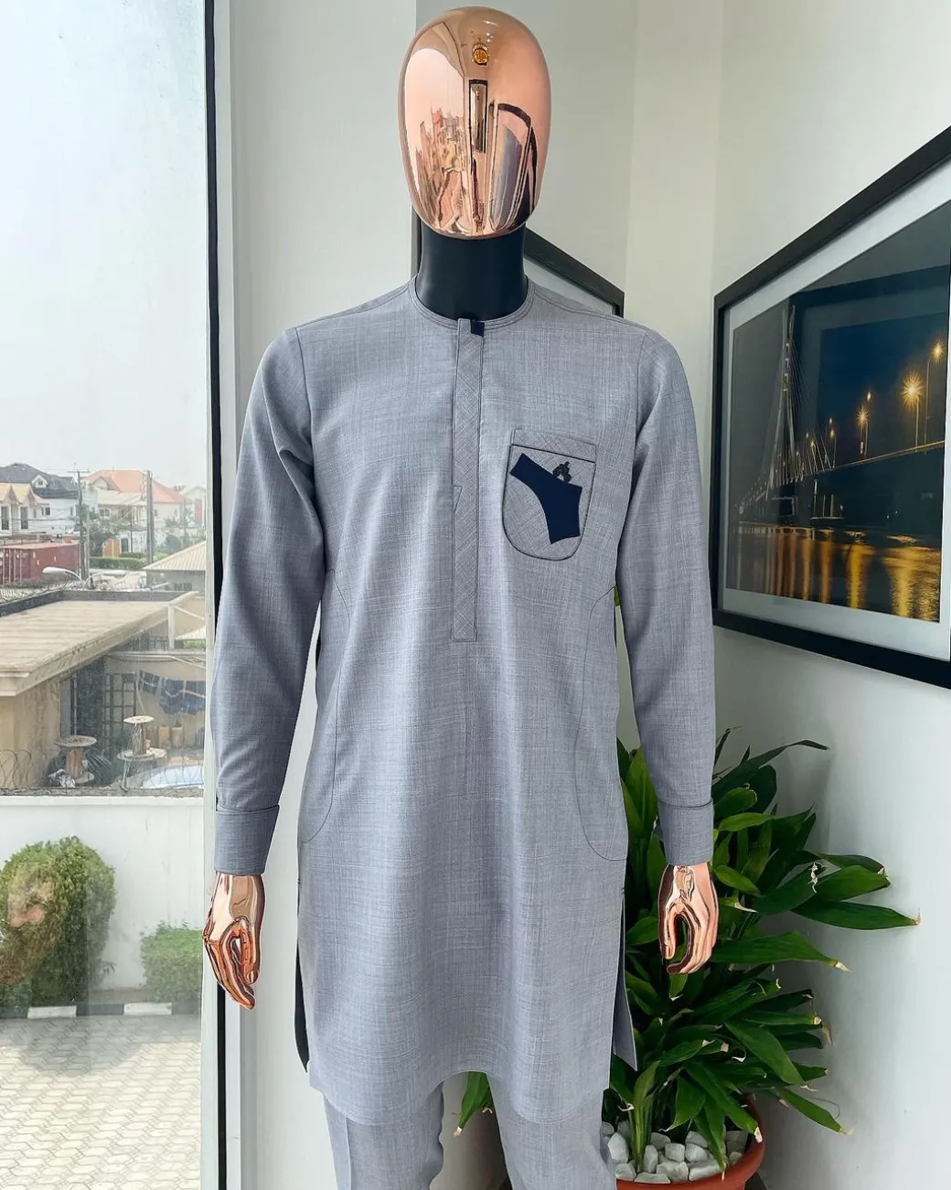 A Baba blue, gun-detailed patch pocket African traditional senator kaftan native.