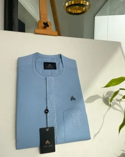 A Baby blue Senator kaftan with bridge and lane dotted front flap & pocket embroidery detailing African traditional native.
