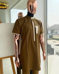 A bishop neck, Peanut and almond cream mix, clear view Swarovski button with layered flap and pocket detailing african traditional senator kaftan native.