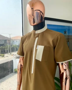 A bishop neck, Peanut and almond cream mix, clear view Swarovski button with layered flap and pocket detailing african traditional senator kaftan native.