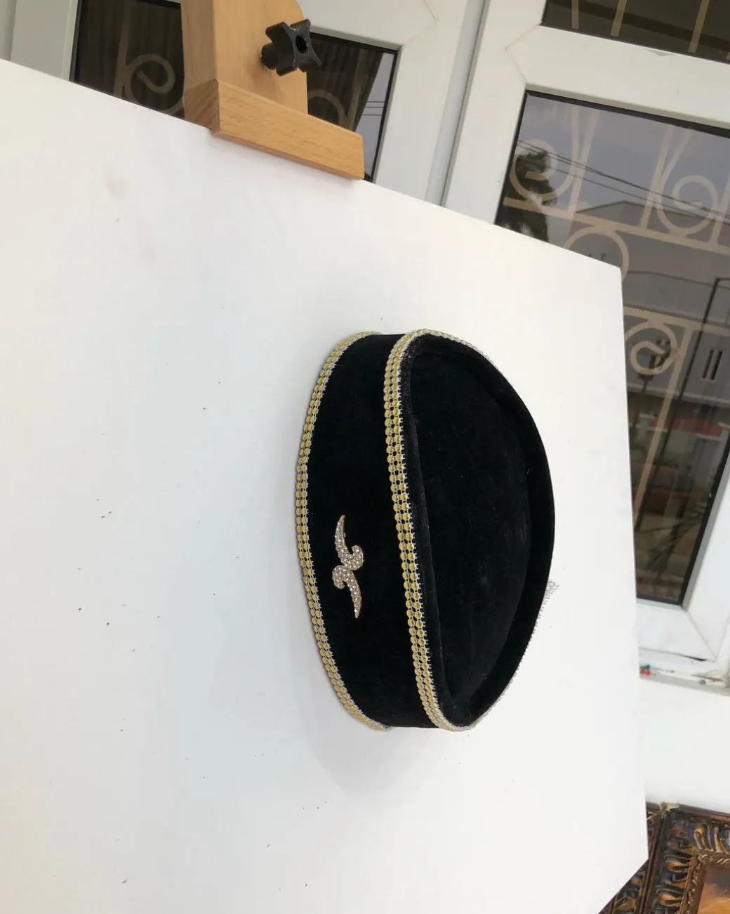 A Black and Gold Ceremonial African Traditional Hat