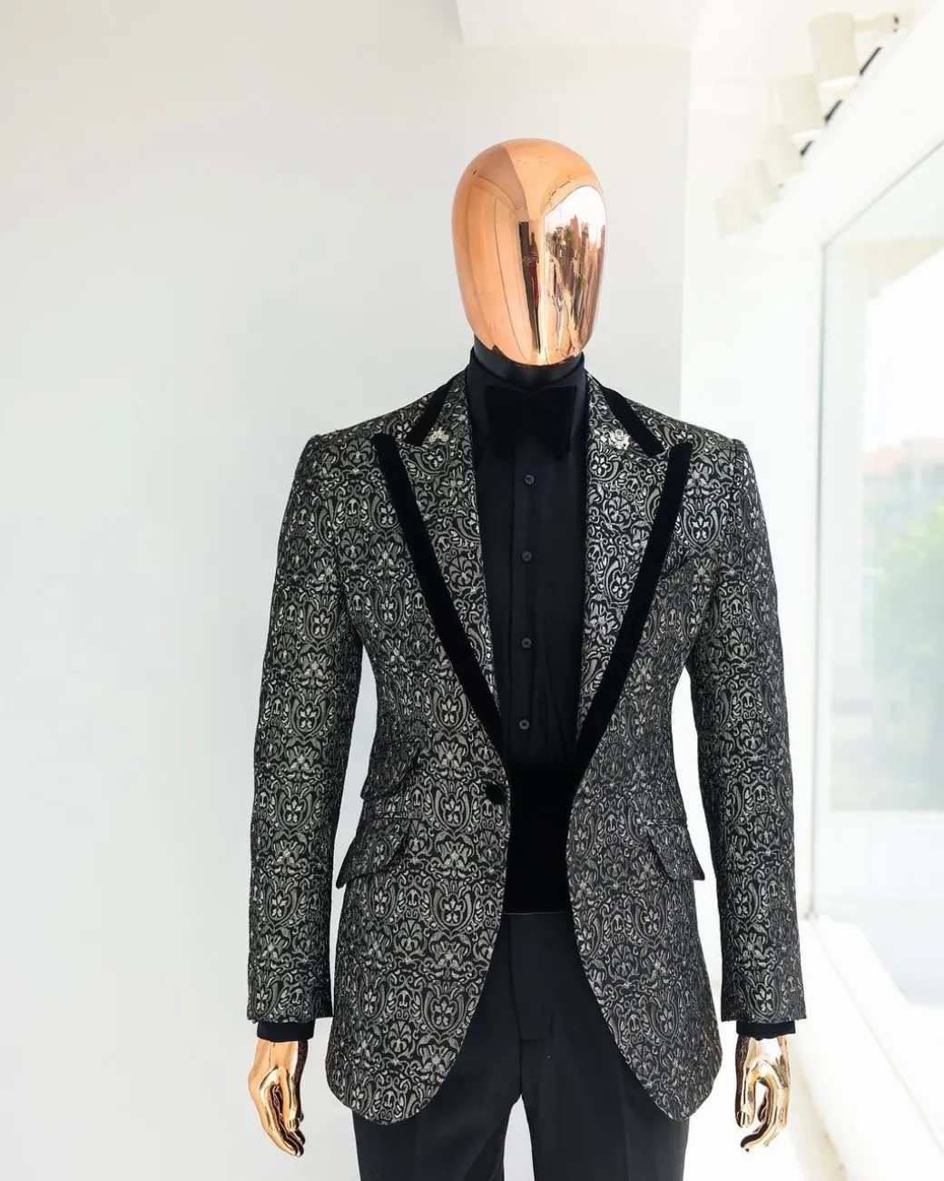 A Black and rust silver pattern jacquard, peak lapel tuxedo suit.