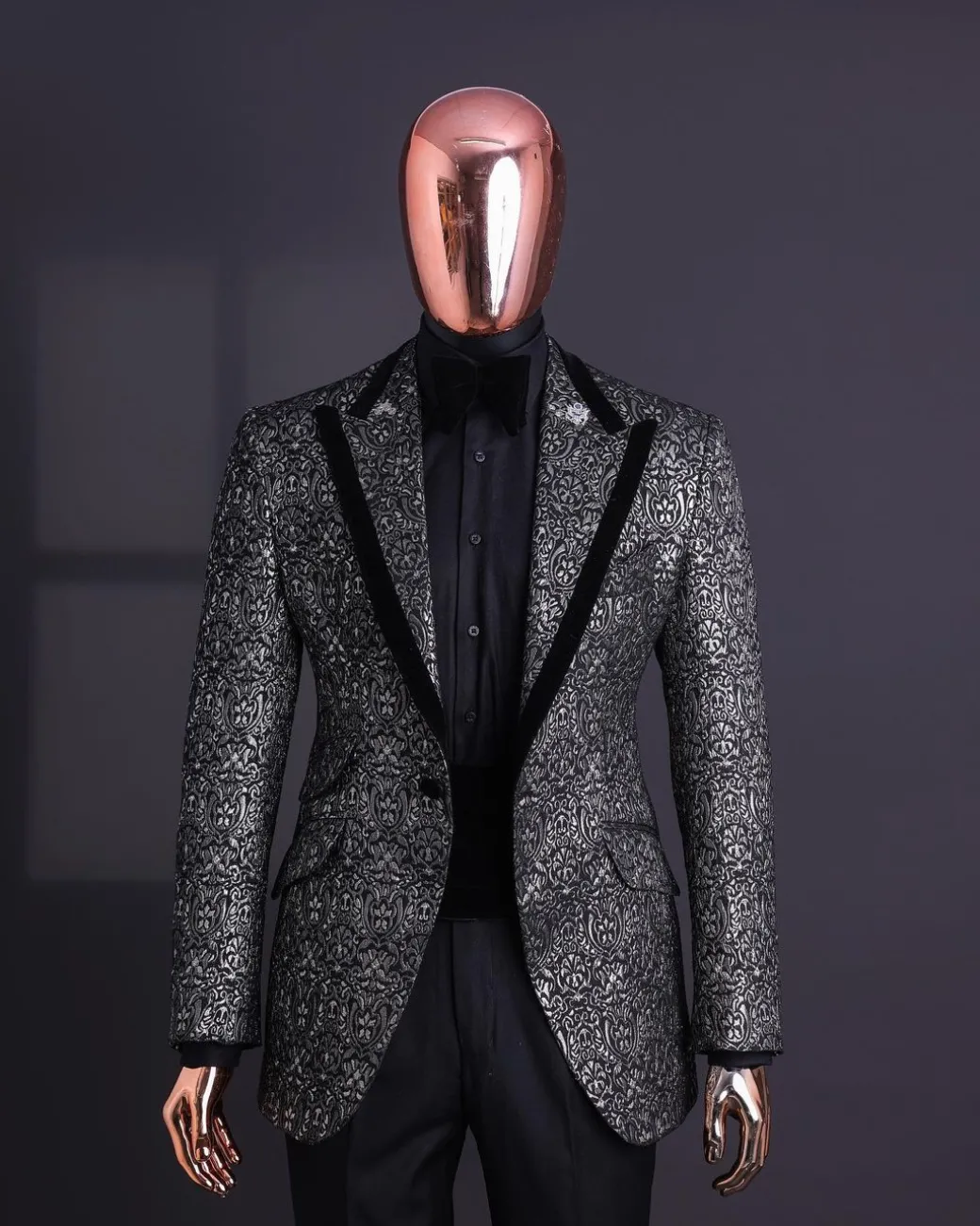 A Black and rust silver pattern jacquard, peak lapel tuxedo suit.
