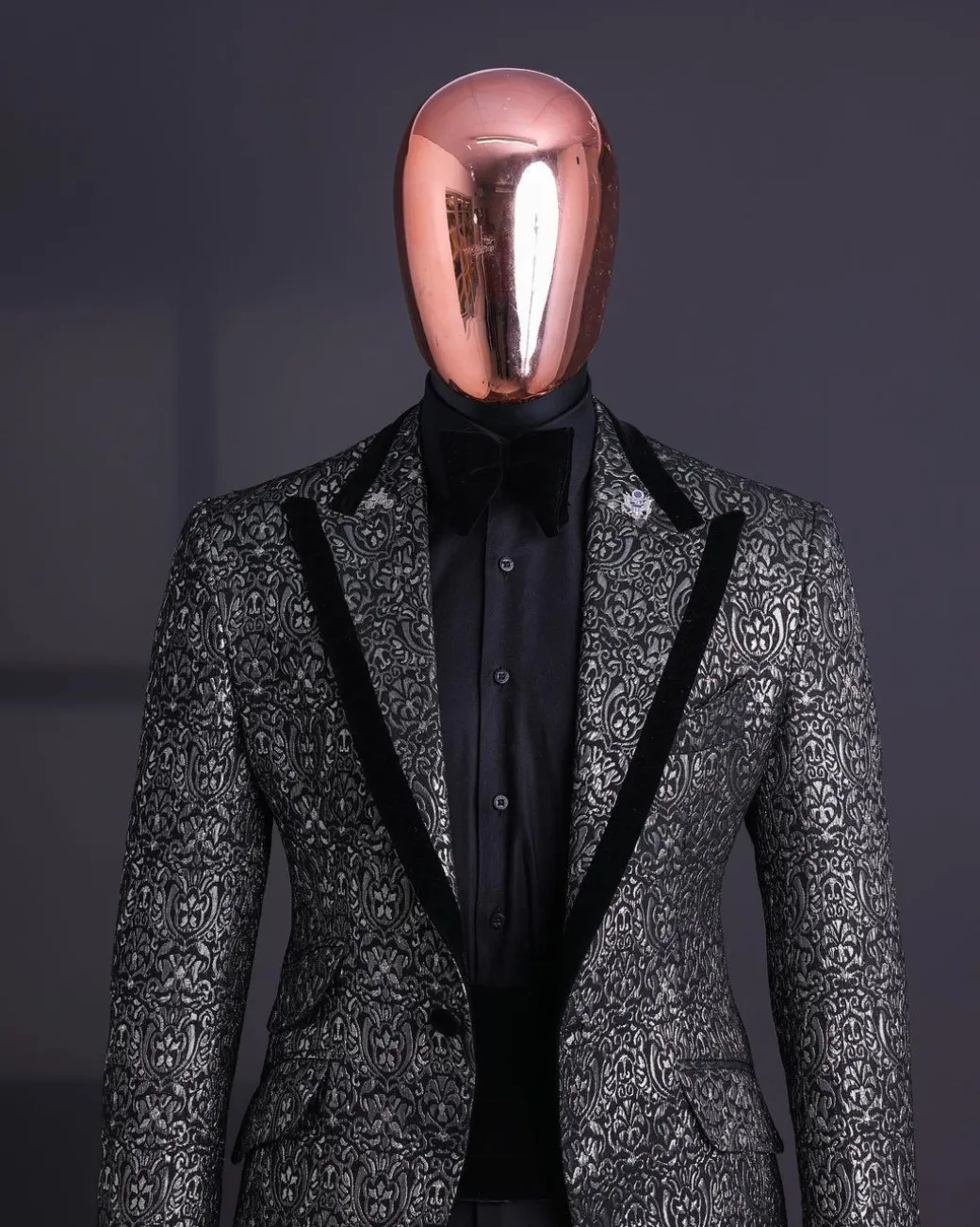 A Black and rust silver pattern jacquard, peak lapel tuxedo suit.