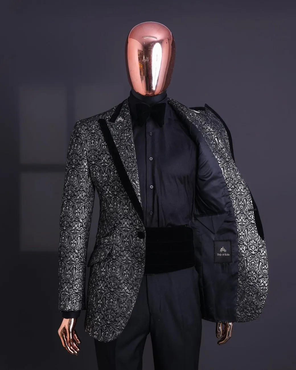 A Black and rust silver pattern jacquard, peak lapel tuxedo suit.