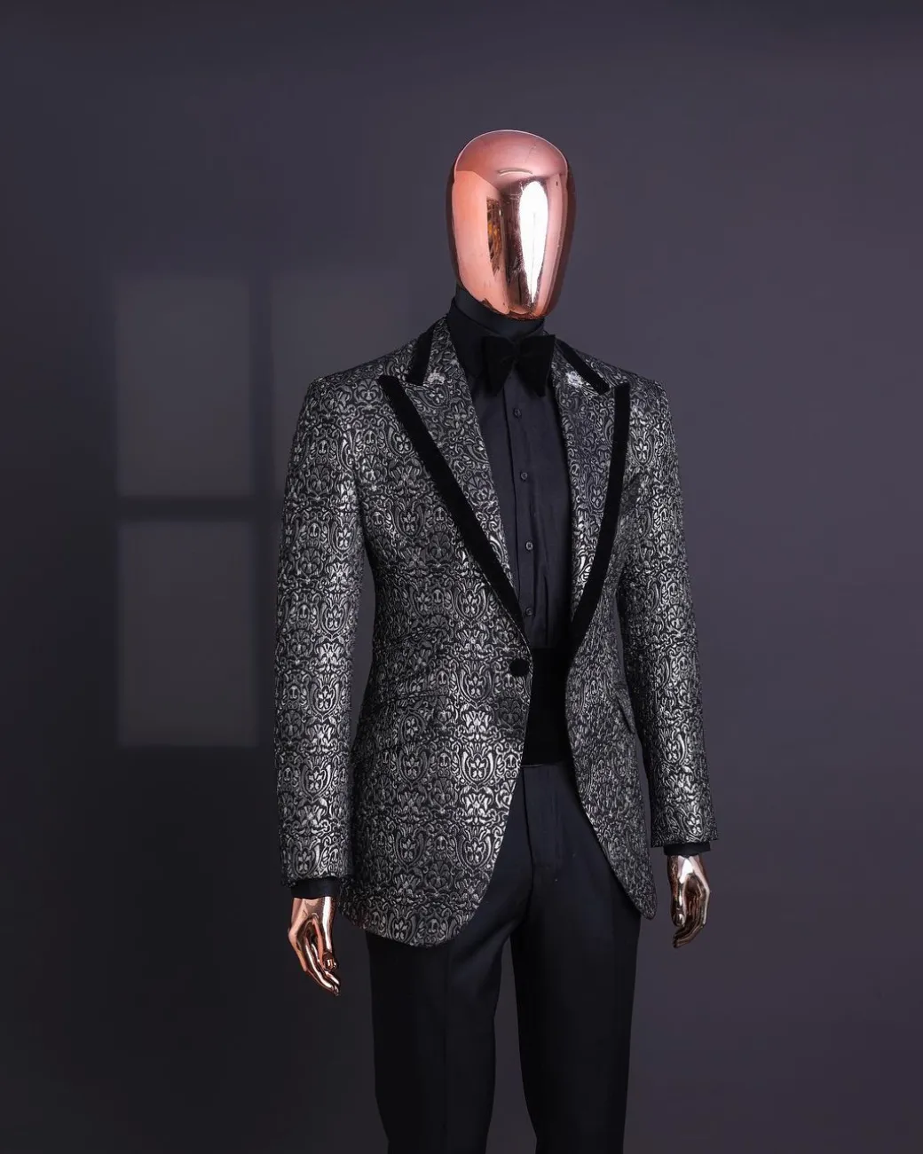 A Black and rust silver pattern jacquard, peak lapel tuxedo suit.