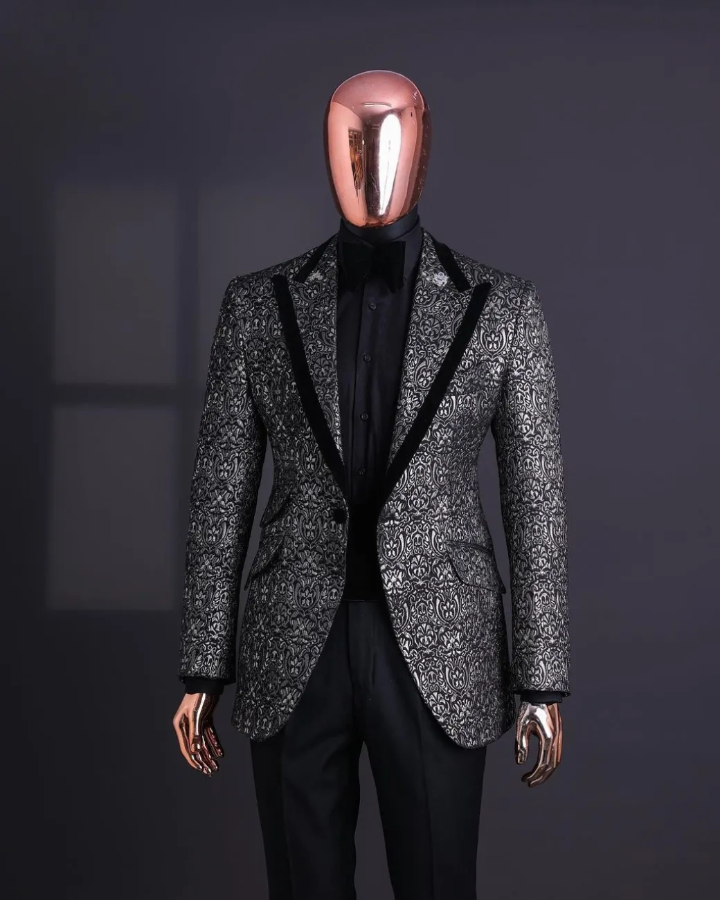 A Black and rust silver pattern jacquard, peak lapel tuxedo suit.