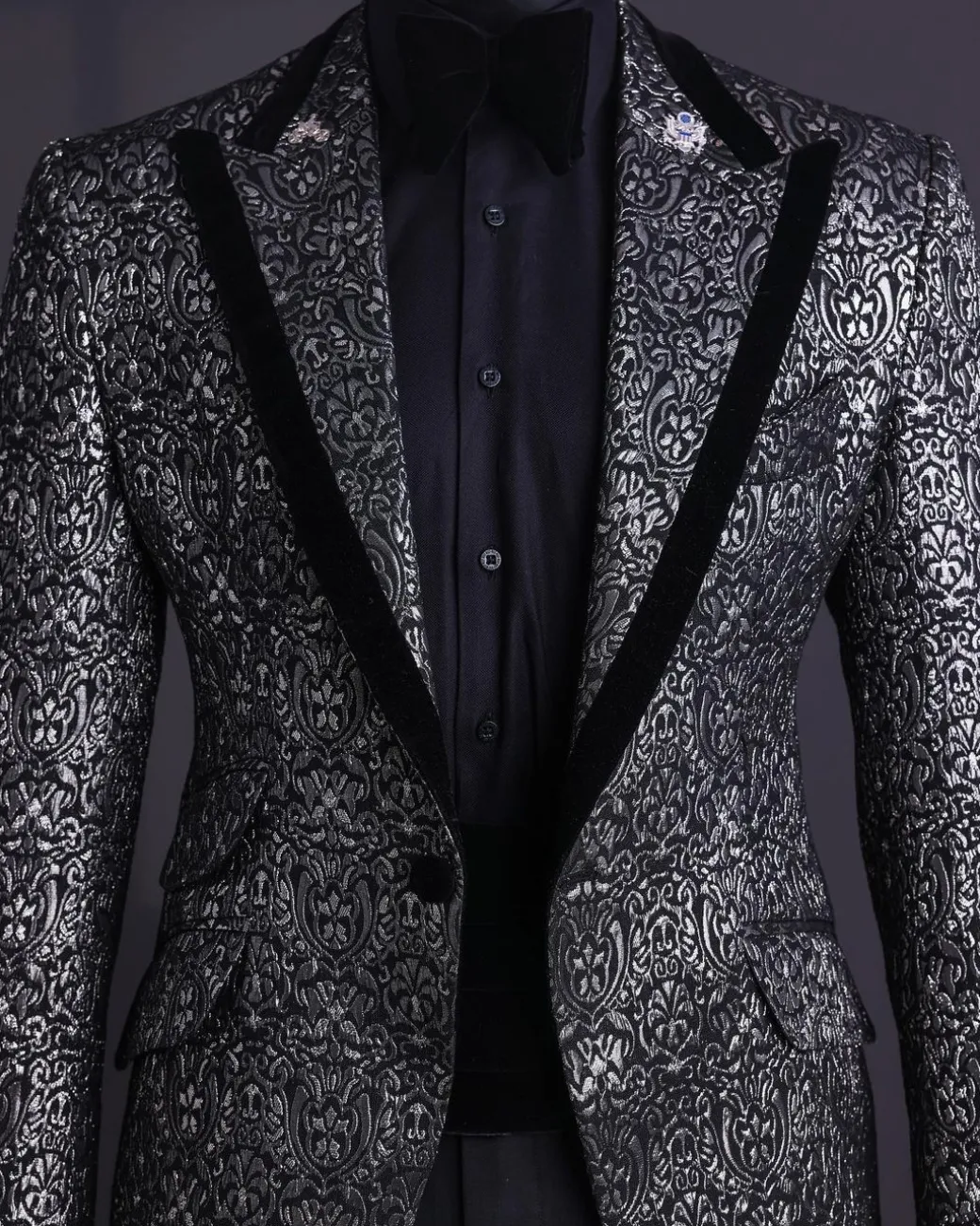 A Black and rust silver pattern jacquard, peak lapel tuxedo suit.