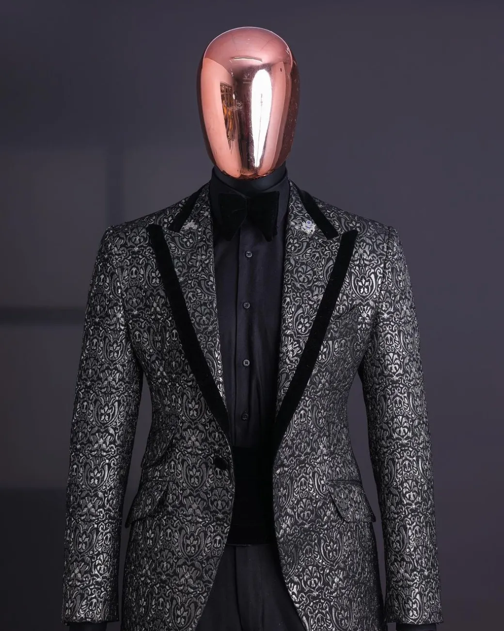 A Black and rust silver pattern jacquard, peak lapel tuxedo suit.