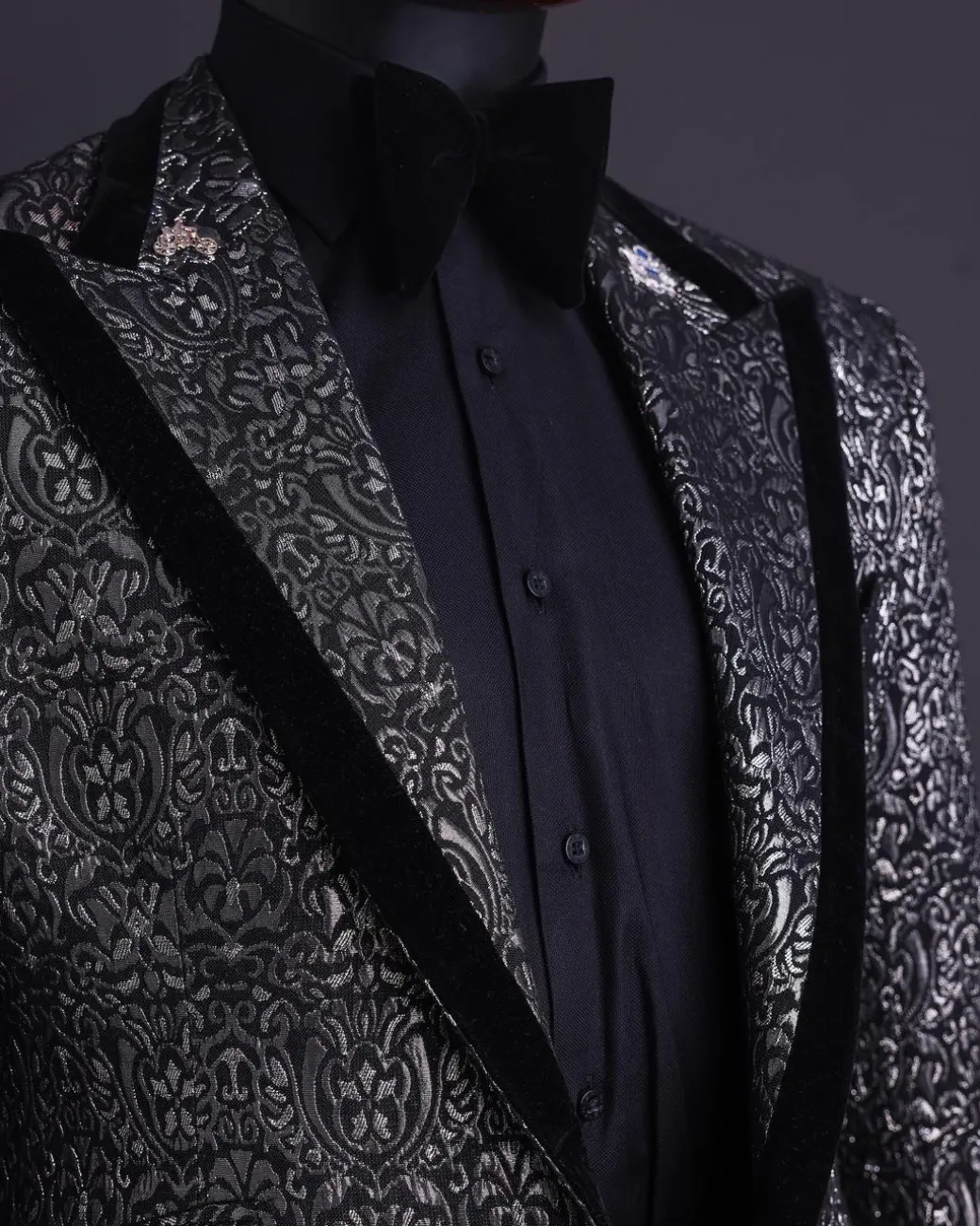 A Black and rust silver pattern jacquard, peak lapel tuxedo suit.