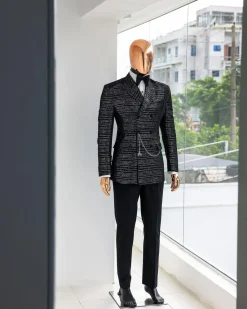 A Black and silver broom metallic scratch pattern jacquard, peak lapel tuxedo, tapered shoulder, double breasted suit