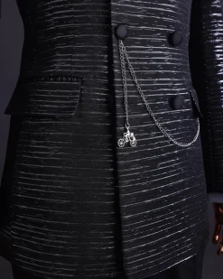 A Black and silver broom metallic scratch pattern jacquard, peak lapel tuxedo, tapered shoulder, double breasted suit