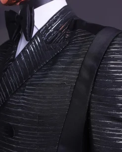 A Black and silver broom metallic scratch pattern jacquard, peak lapel tuxedo, tapered shoulder, double breasted suit