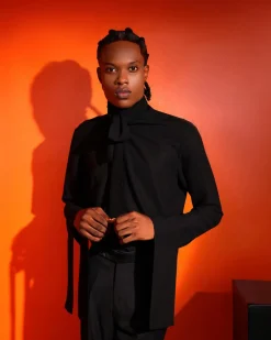 A black, covered neck shirt.