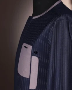 A black pencil stripe, dropping pocket, front flap, long sleeve African senator kaftan native.