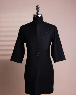 A black pencil stripe, mug-shaped pocket, front flap with buckle strap and silver Swarovski button, 3/4 sleeve African senator kaftan.