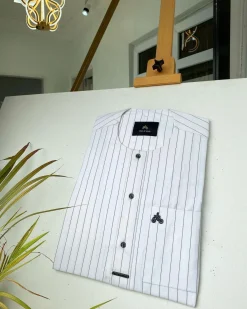 A black stripe and white African kaftan with black Swarovski buttons detailing and sokoto