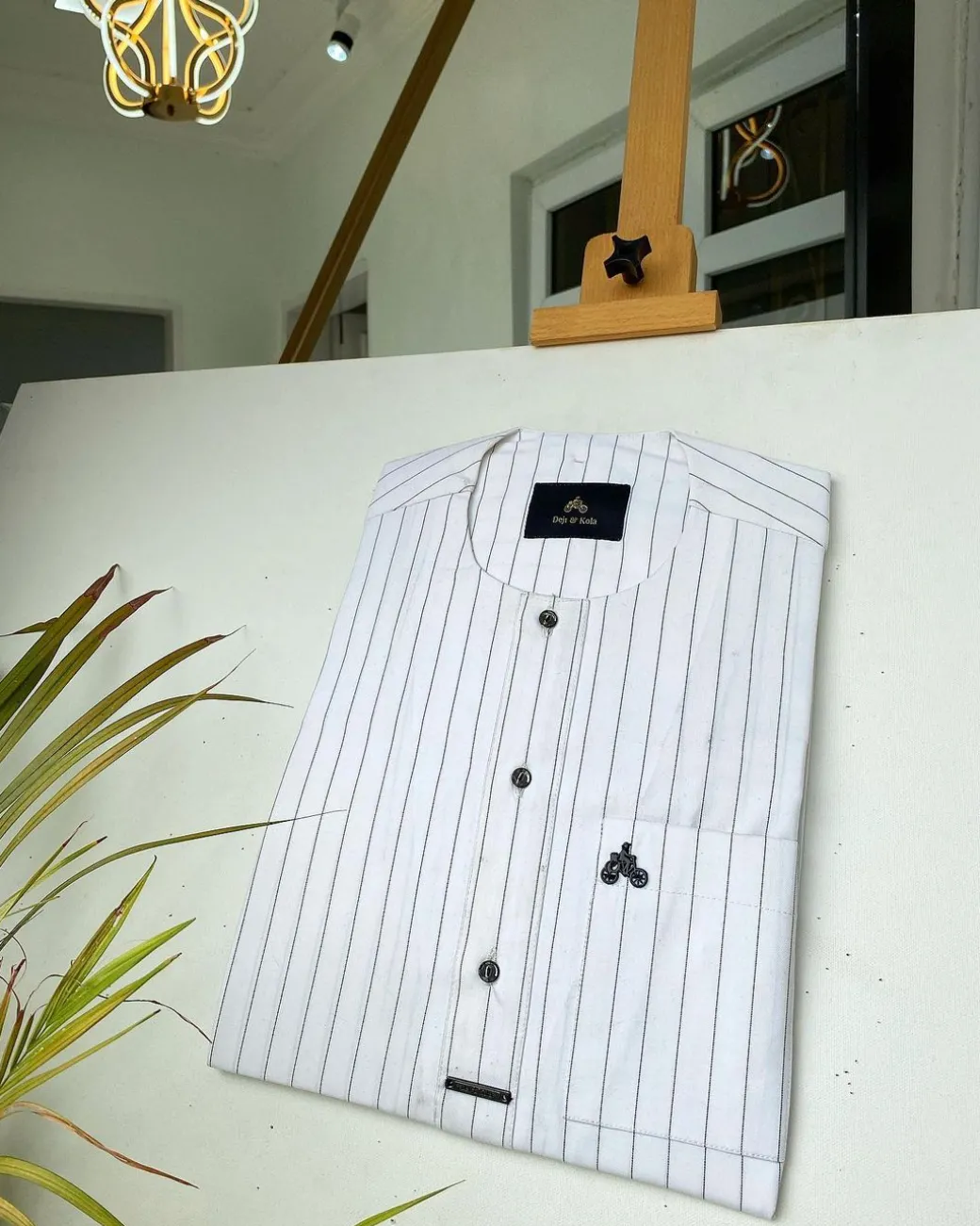 A black stripe and white African kaftan with black Swarovski buttons detailing and sokoto