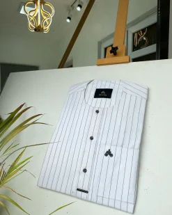 A black stripe and white African kaftan with black Swarovski buttons detailing and sokoto