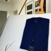 A blue and red stripe kaftan, interlocking neck piping