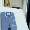 A blue and white windowpane check, front flap details African traditional senator kaftan native.