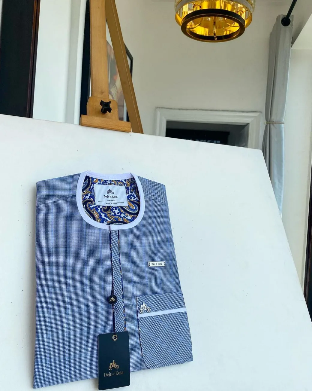 A blue and white windowpane check, front flap details African traditional senator kaftan native.