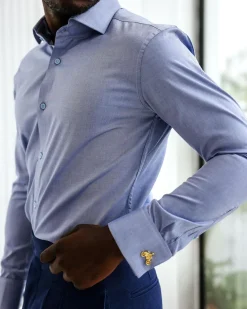 A Blue Oxford Business Shirt.