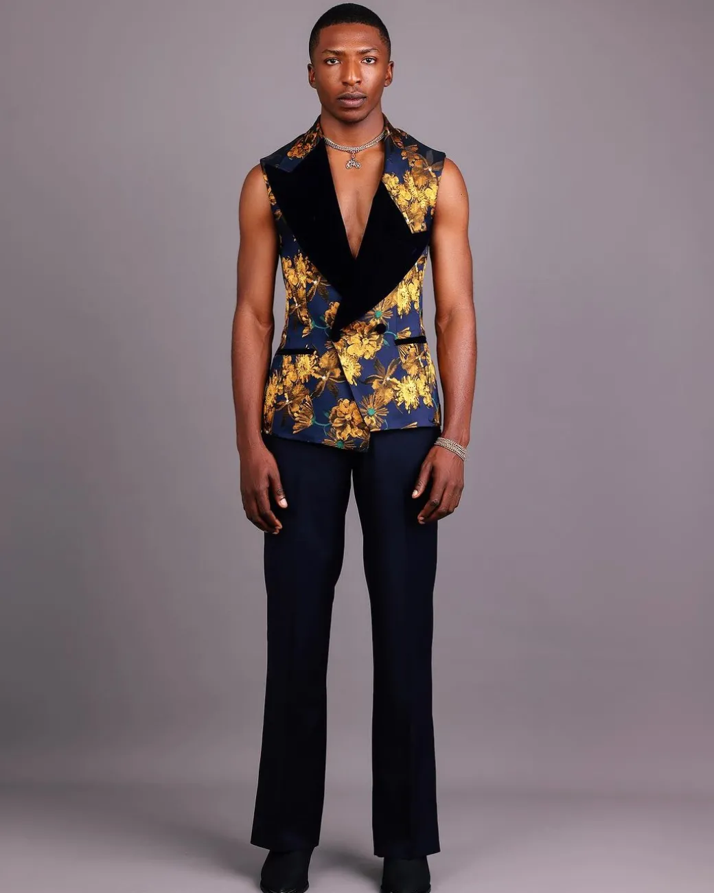 A “Boomerang” Sleeveless, Adjusted Peak Lapel Floral Jacquard Tuxedo Suit & Wide Cut Pant Trouser.
