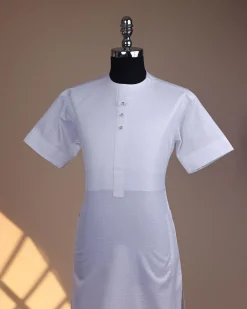 A bright white, front flap with Swarovski button, invisible zip line neck details, short sleeve African kaftan