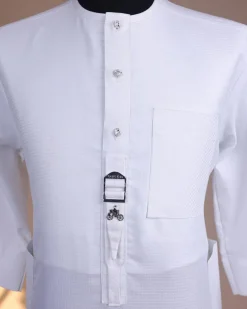 A Bright white, front flap with Swarovski button & metal tag details, 3/4 sleeve African kaftan