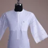 A bright white, Swiss patterned lace, front flap with left side pattern, Swarovski button, 3/4 sleeve African kaftan.