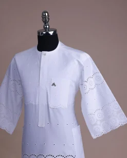 A bright white, Swiss patterned lace, front flap with Swarovski button, 3/4 sleeve African kaftan.