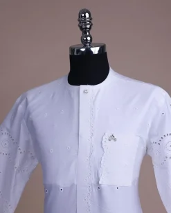 A bright white, Swiss patterned lace, front flap with left side pattern, Swarovski button, 3/4 sleeve African kaftan.