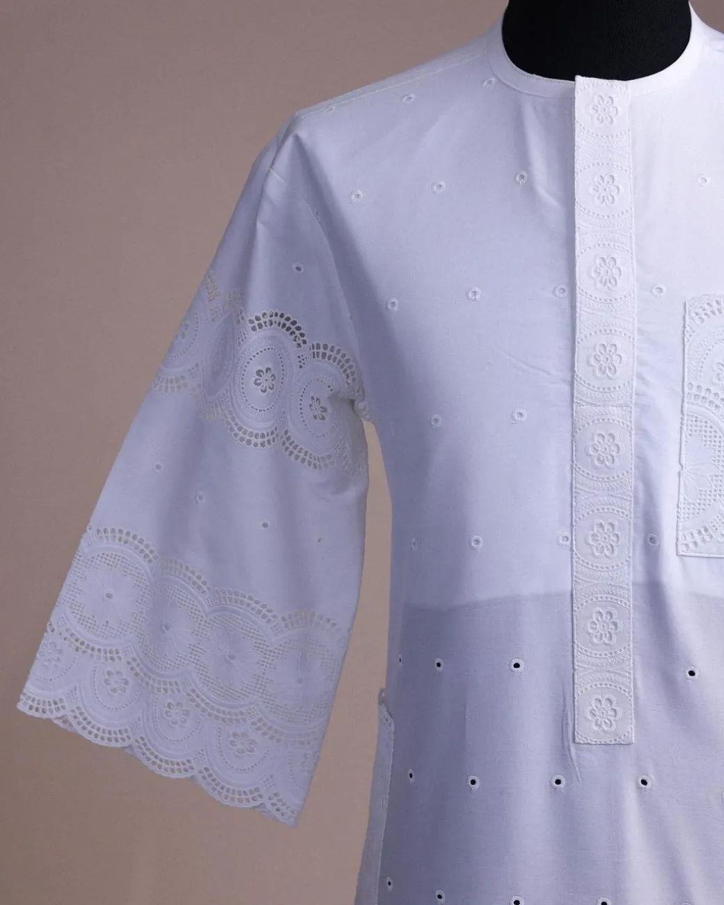 A bright white, Swiss patterned lace, front flap, 3/4 sleeve African kaftan native.