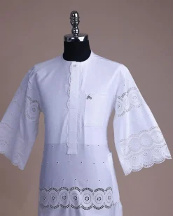 A bright white, Swiss patterned lace, front flap with side pattern, Swarovski button, 3/4 sleeve African kaftan native.
