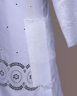 A bright white, Swiss patterned lace, front flap, 3/4 sleeve African kaftan native.
