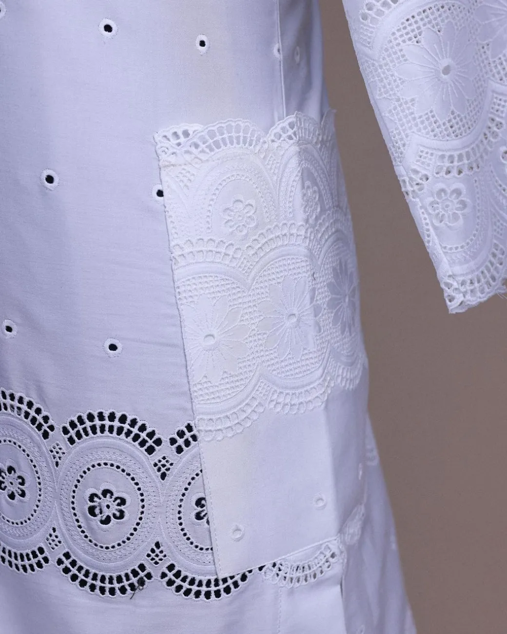 A bright white, Swiss patterned lace, front flap, 3/4 sleeve African kaftan native.