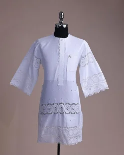 A bright white, Swiss patterned lace, front flap with side pattern, Swarovski button, 3/4 sleeve African kaftan native.