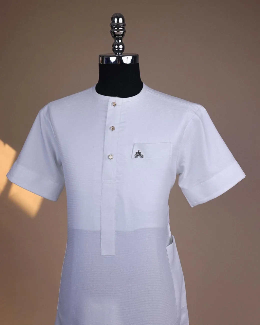 A bright white, tiny square pattern, front flap with gold Swarovski button, 3/4 sleeve African kaftan.