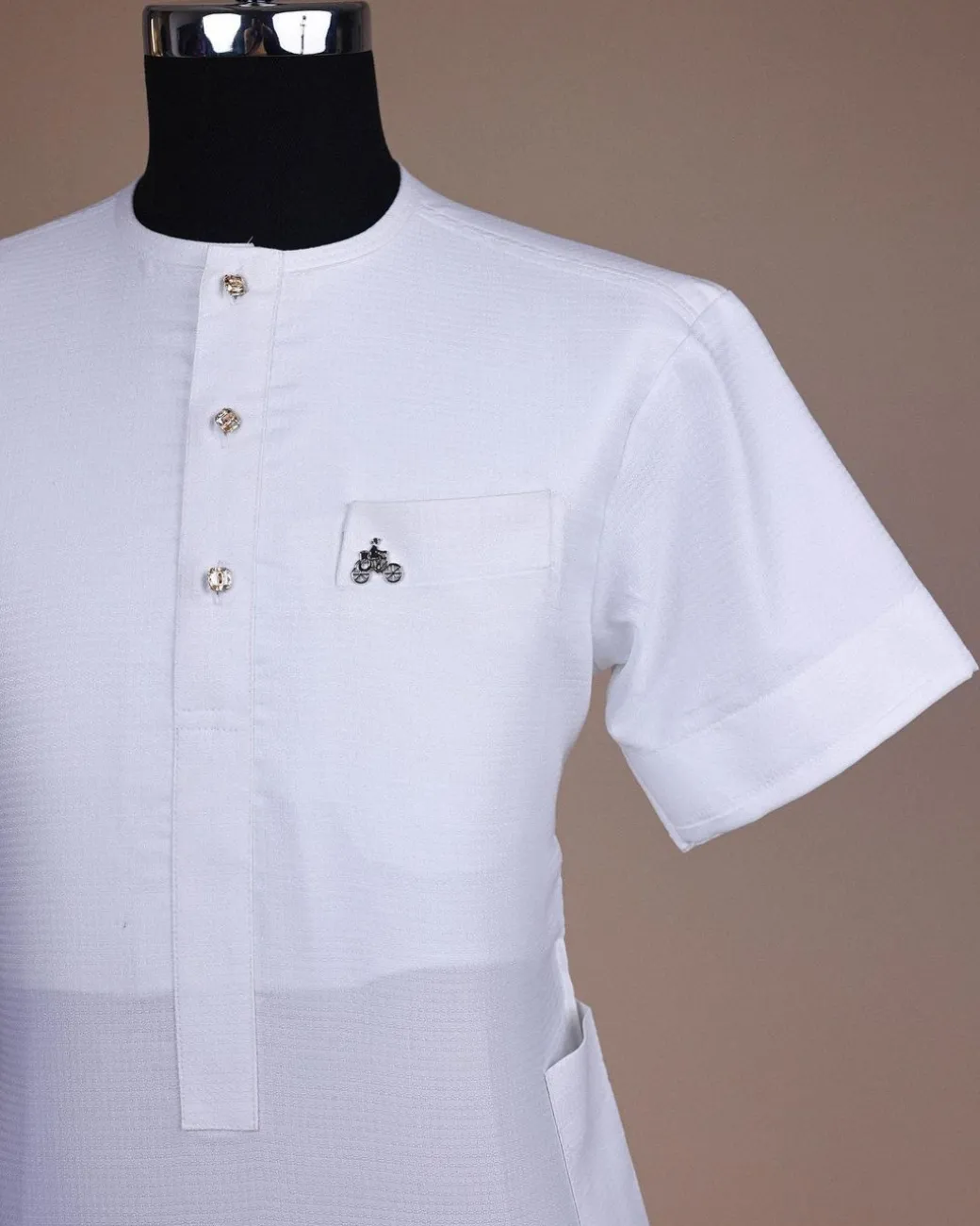 A bright white, tiny square pattern, front flap with gold Swarovski button, 3/4 sleeve African kaftan.