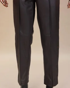A brown leather, knitted & outer layered pant Trouser with side opening.