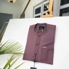 A Brown onion-coloured kaftan with brown coconut shell button detailing, paisley details