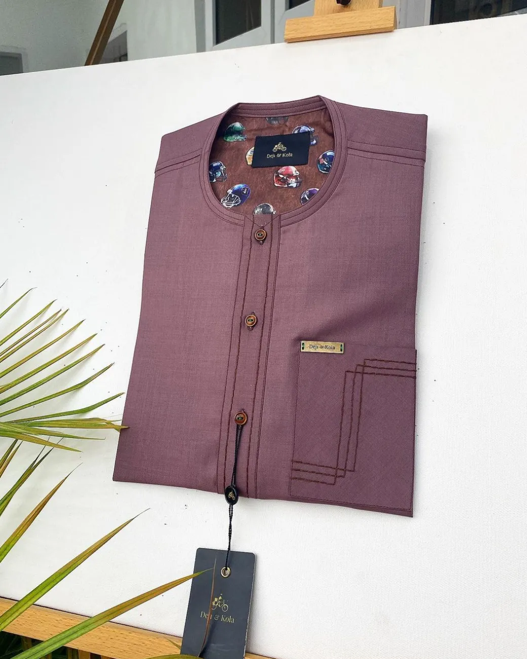 A Brown onion-coloured kaftan with brown coconut shell button detailing, paisley details