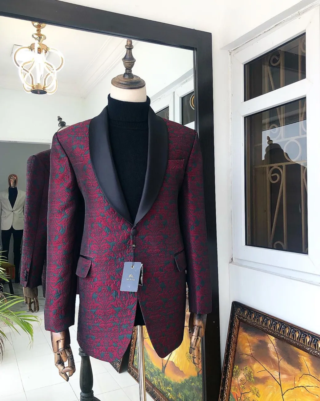 A Burgundy And Black Paisley Shawl Lapel Tuxedo Suit