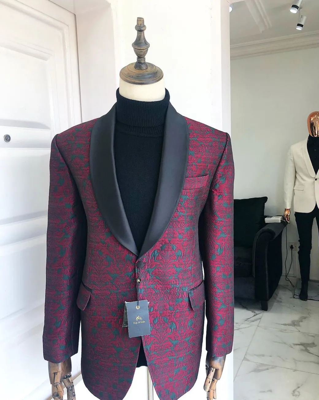 A Burgundy And Black Paisley Shawl Lapel Tuxedo Suit