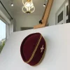 A Burgundy and Gold Ceremonial African Traditional Hat