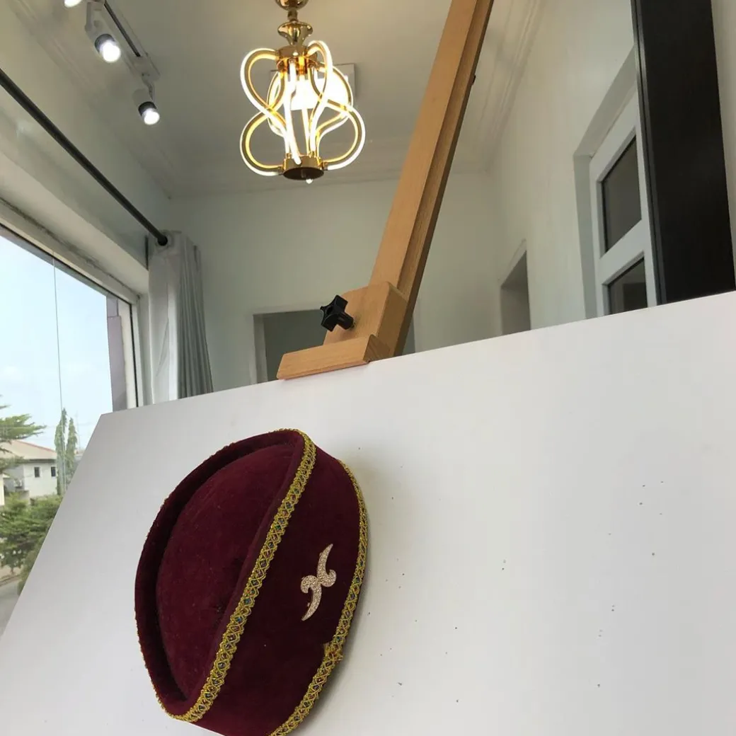 A Burgundy and Gold Ceremonial African Traditional Hat