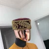 A Burgundy and gold embroidery African traditional hat