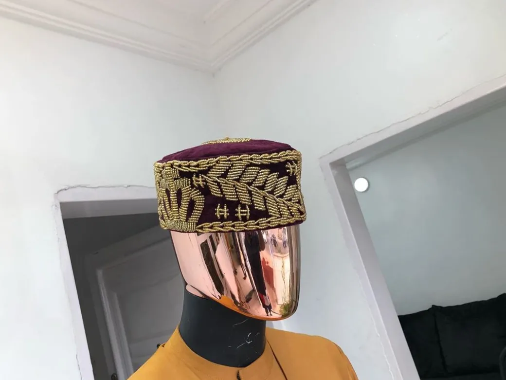 A Burgundy and gold embroidery African traditional hat