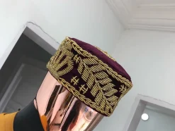 A Burgundy and gold embroidery African traditional hat